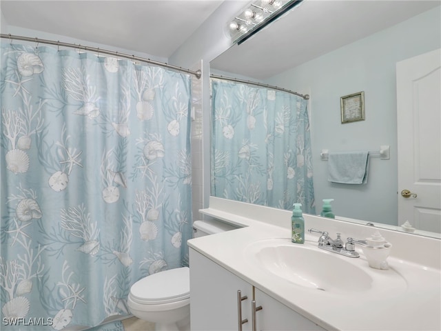 bathroom with vanity and toilet