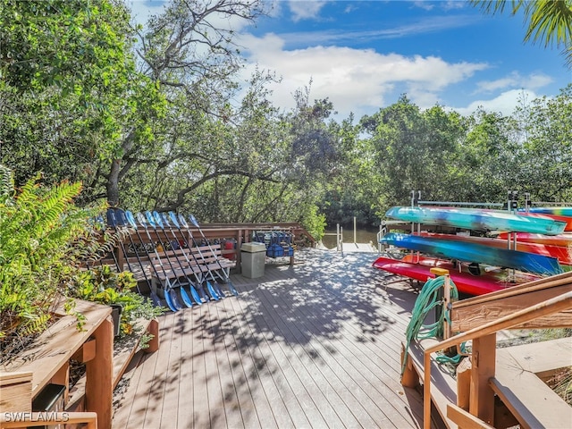 25051 Ballycastle Ct Unit 102, Bonita Springs, FL 34134 - wooden deck featuring view of wooded area and a water view