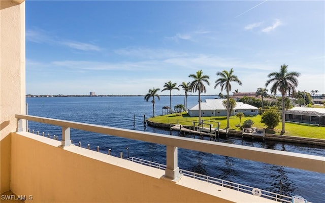 dock area featuring a balcony and a water view