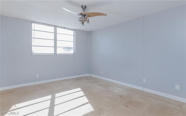 spare room with ceiling fan