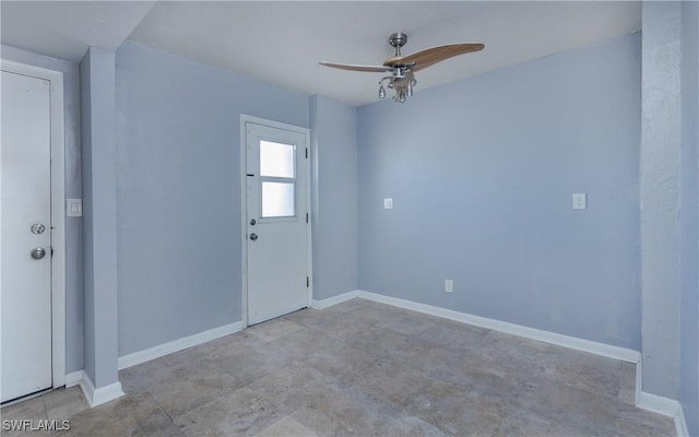 foyer entrance with ceiling fan