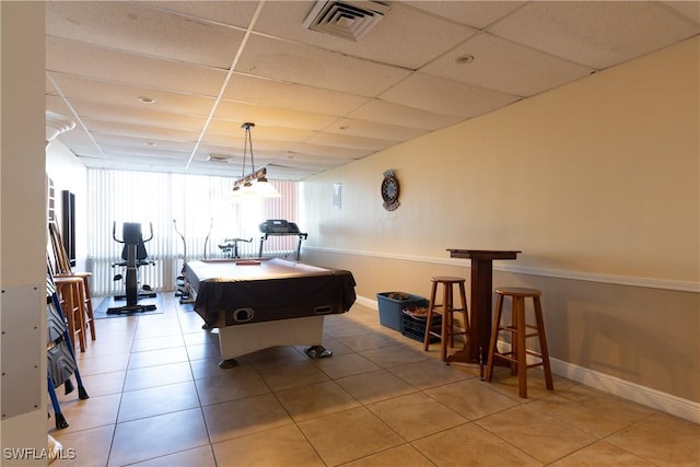 game room with a drop ceiling, light tile patterned flooring, and pool table