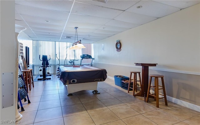 recreation room featuring a drop ceiling, light tile patterned flooring, and billiards