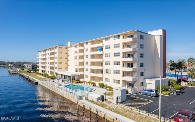 view of building exterior with a water view