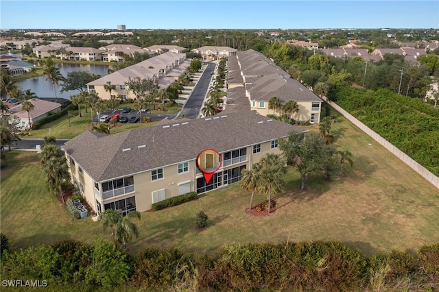 birds eye view of property featuring a residential view and a water view