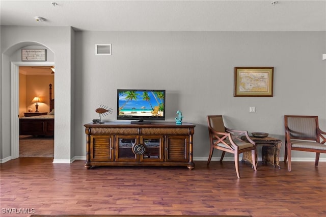 14712 Calusa Palms Dr Unit 103, Fort Myers, FL 33919 - living area with wood finished floors, baseboards, and arched walkways