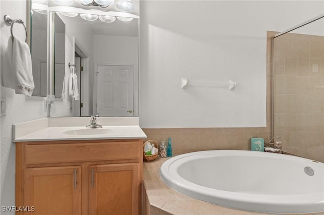 14712 Calusa Palms Dr Unit 103, Fort Myers, FL 33919 - full bath featuring a tub to relax in and vanity