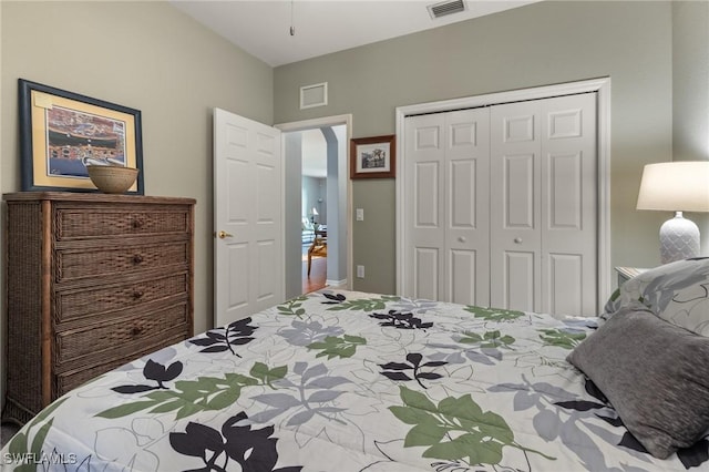 bedroom featuring a closet and visible vents