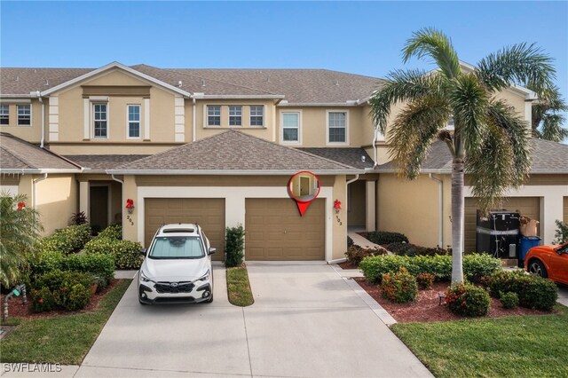 14712 Calusa Palms Dr Unit 103, Fort Myers, FL 33919 - multi unit property with concrete driveway, stucco siding, an attached garage, and a shingled roof