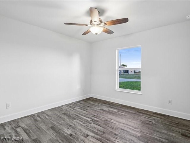 unfurnished room featuring ceiling fan and dark hardwood / wood-style floors