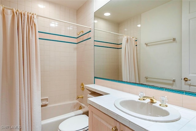 bathroom with decorative backsplash, vanity, toilet, and shower / bath combo with shower curtain