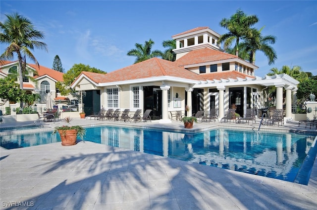 community pool with a patio area