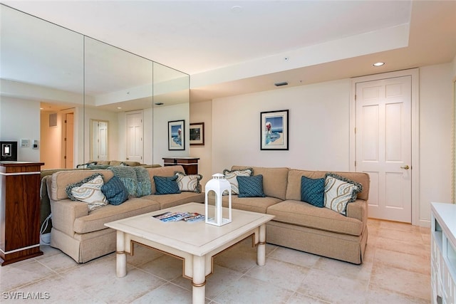 living room featuring visible vents and recessed lighting