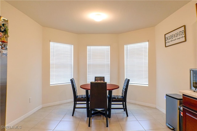 dining room featuring light tile patterned flooring