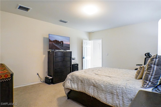 bedroom featuring light colored carpet