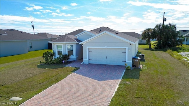 ranch-style house featuring a front lawn and a garage