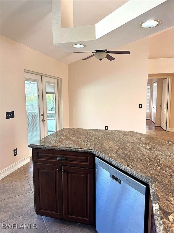 kitchen featuring french doors, stainless steel dishwasher, ceiling fan, light tile patterned floors, and dark brown cabinets