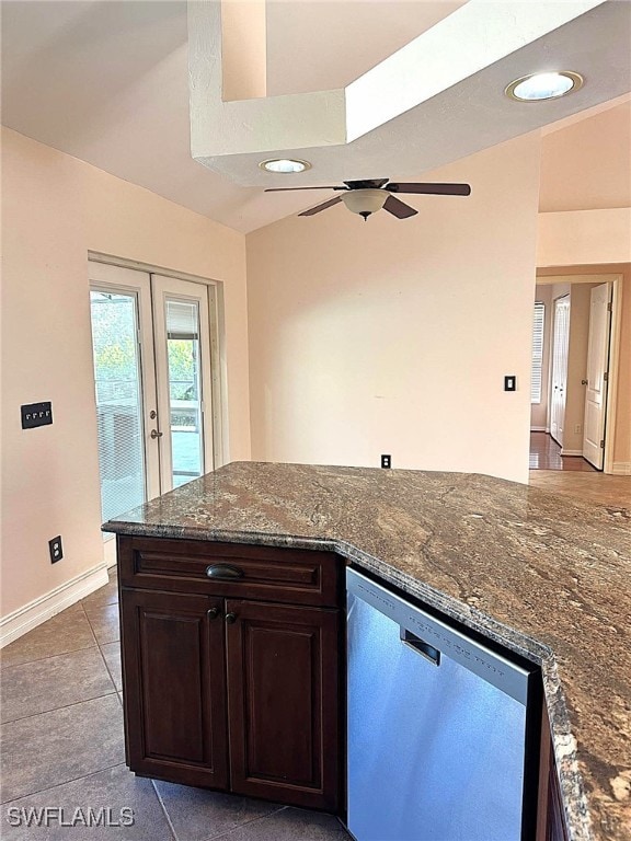 kitchen featuring dishwasher, dark stone counters, ceiling fan, dark brown cabinets, and french doors