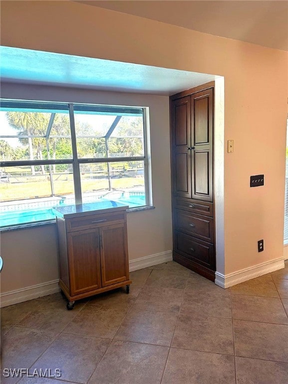 interior space featuring light tile patterned flooring