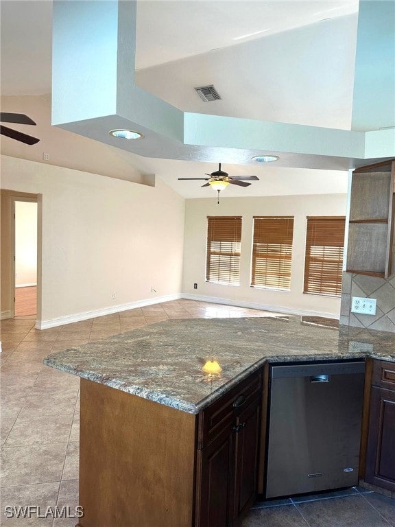 kitchen with stainless steel dishwasher, ceiling fan, and stone counters