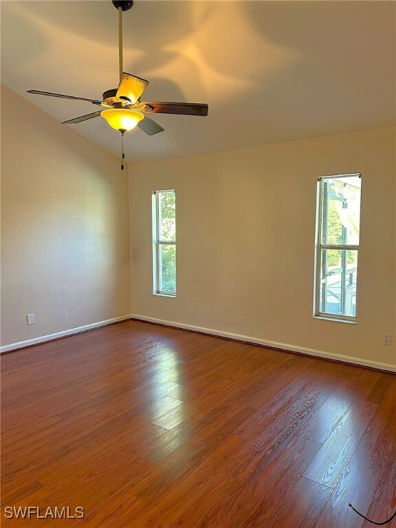 unfurnished room with wood-type flooring and ceiling fan