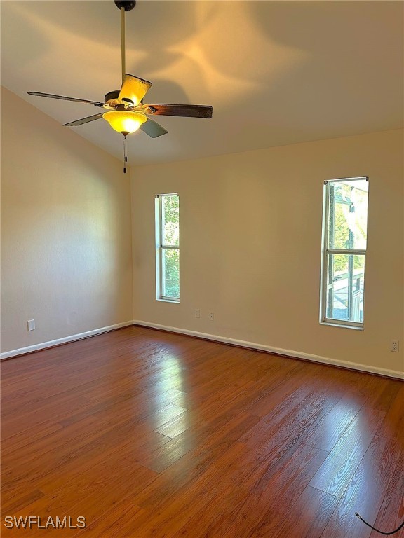 unfurnished room featuring hardwood / wood-style floors and ceiling fan