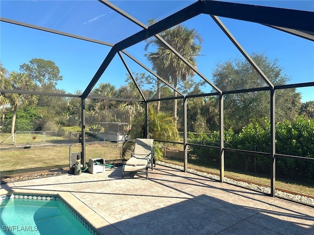 view of patio / terrace featuring glass enclosure