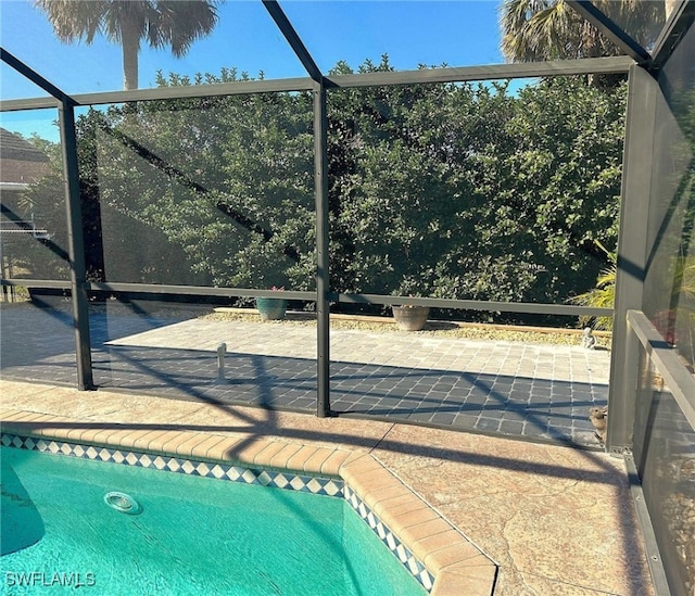 view of swimming pool with a patio area