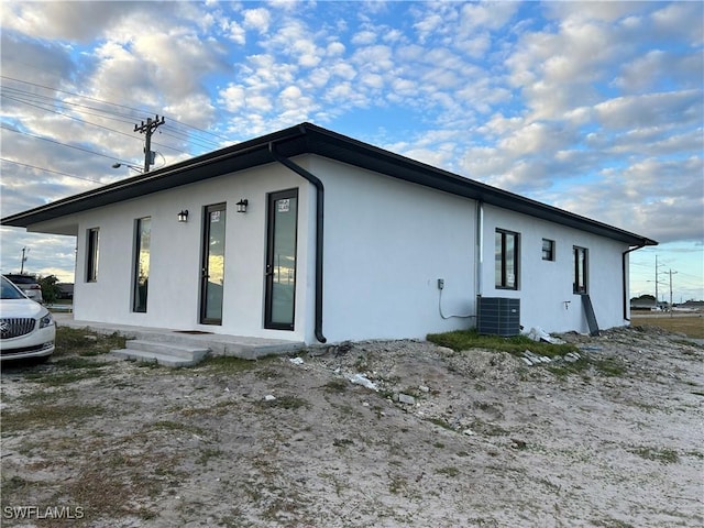 view of side of home with cooling unit