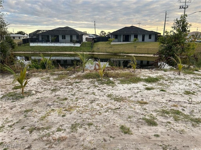 yard at dusk with a water view