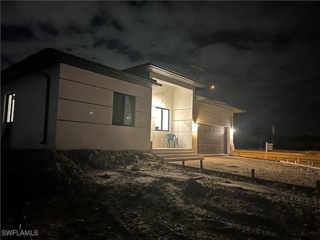 property exterior at twilight with a garage