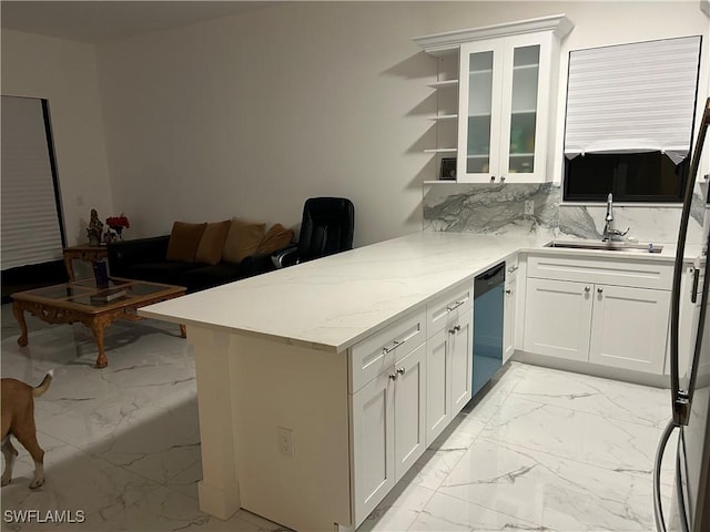 kitchen featuring sink, white cabinetry, light stone counters, black dishwasher, and kitchen peninsula