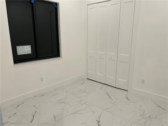 unfurnished bedroom with a closet