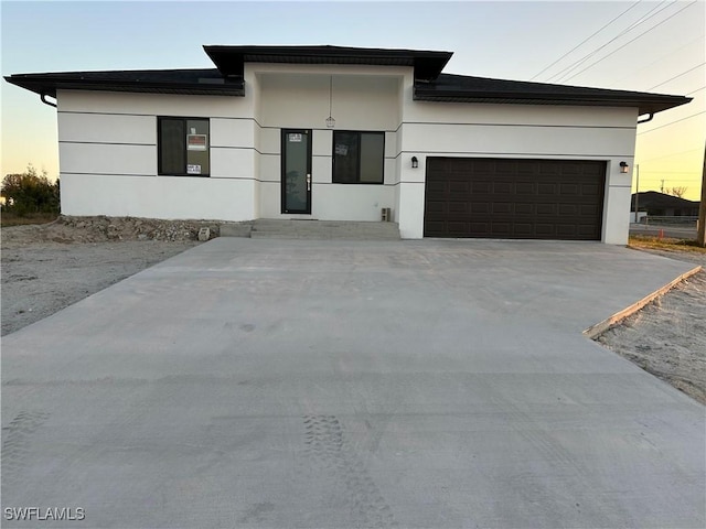 view of front of property with a garage