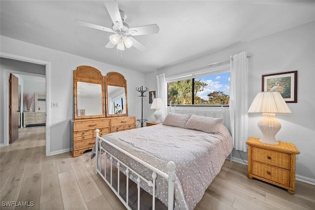 bedroom with ceiling fan and light wood-type flooring