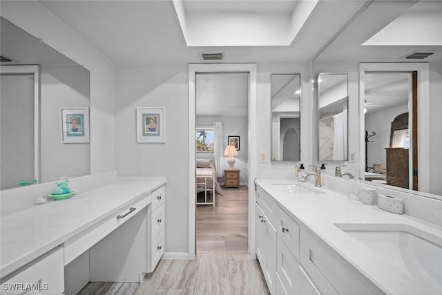 bathroom featuring hardwood / wood-style floors and vanity