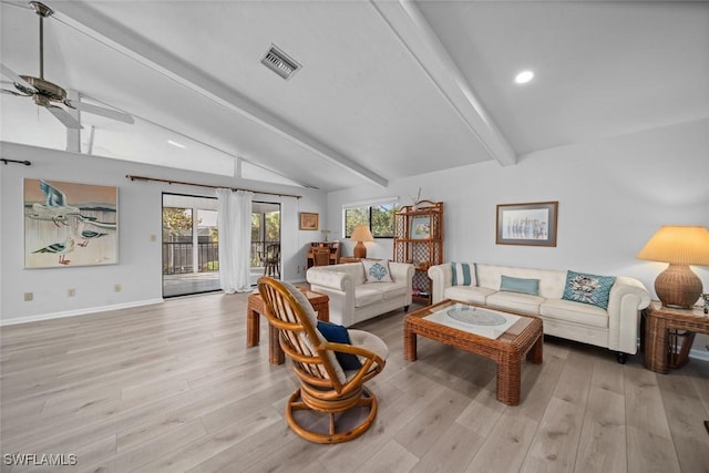 living room featuring vaulted ceiling with beams, ceiling fan, plenty of natural light, and light hardwood / wood-style flooring