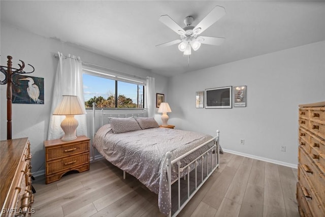 bedroom featuring light wood-type flooring and ceiling fan