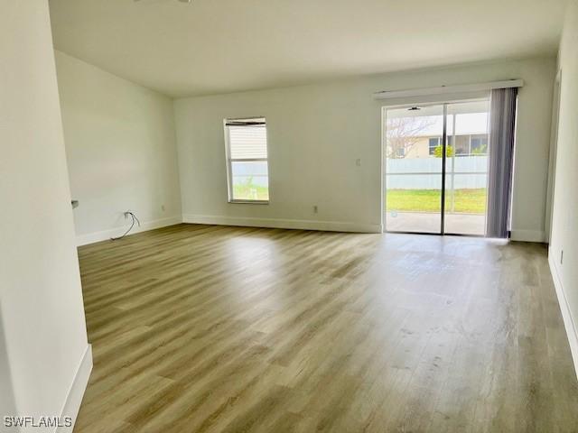 spare room with hardwood / wood-style flooring