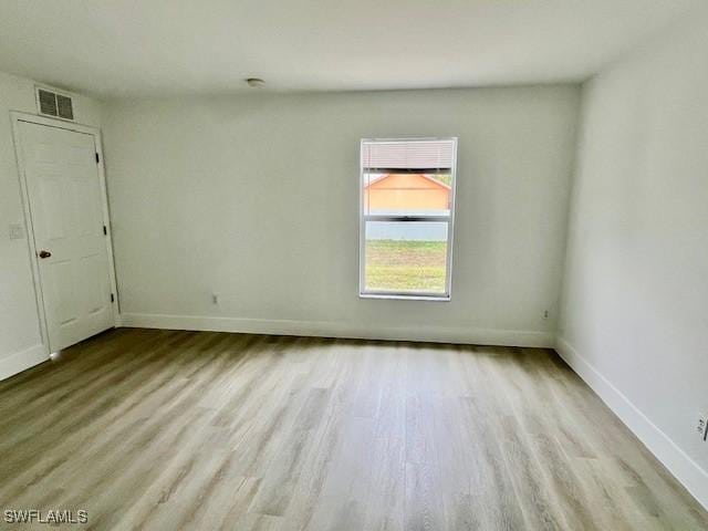 empty room with light wood-type flooring