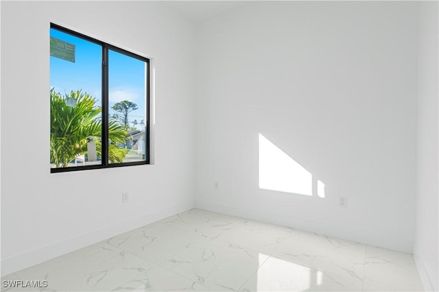 spare room featuring a wealth of natural light