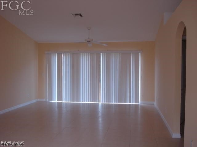 unfurnished room featuring ceiling fan