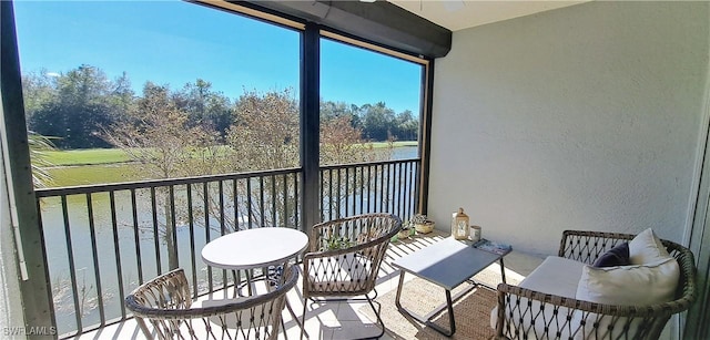 balcony featuring a water view