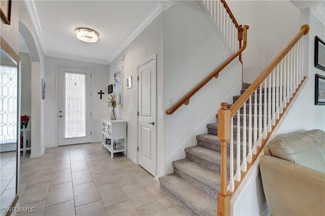 2122 Hamlin St, Naples, FL 34120 - entryway with arched walkways, light tile patterned floors, stairway, and ornamental molding