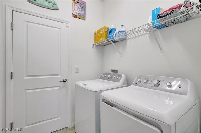 laundry room featuring washing machine and dryer