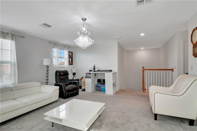 living room featuring a wealth of natural light, light colored carpet, and a notable chandelier