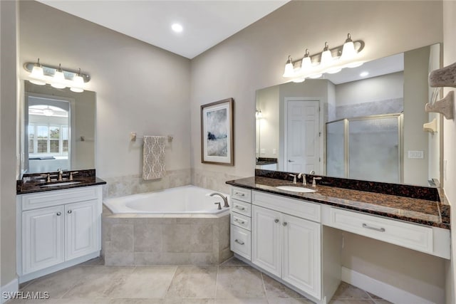 bathroom featuring vanity, tile patterned floors, and shower with separate bathtub