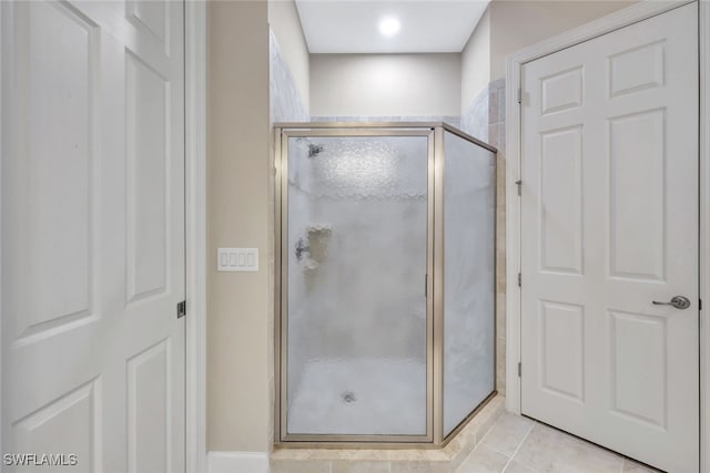 bathroom featuring tile patterned floors and walk in shower