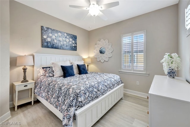 bedroom featuring ceiling fan and light hardwood / wood-style flooring