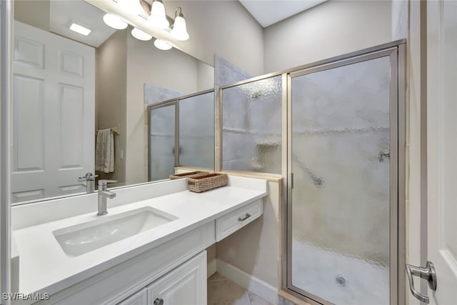 bathroom featuring vanity, tile patterned floors, and an enclosed shower